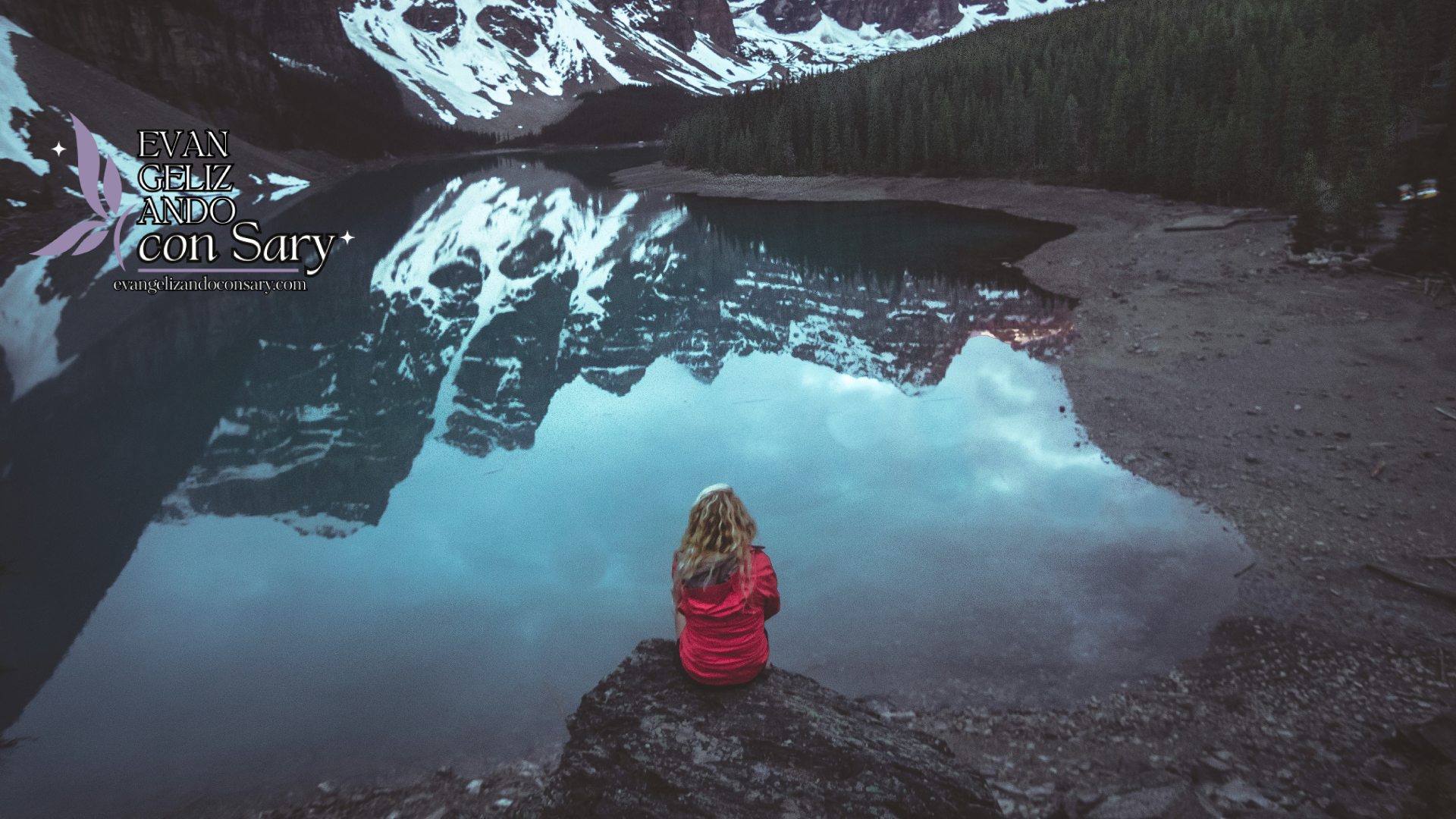 Person looking out over a calm lake reflecting on hope restored through faith’s strength